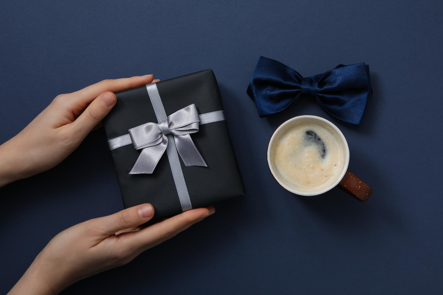 hand holding a premium gift for corporate gifting